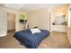 Bedroom with carpet, desk, and a bed covered with a blue bedspread at 6433 Stone Terrace Ter, Morrow, GA 30260