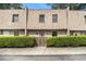 Charming townhome featuring a unique roofline and tidy front yard landscaping at 6433 Stone Terrace Ter, Morrow, GA 30260