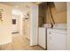 Bright laundry room with washer and dryer and tile floors at 6433 Stone Terrace Ter, Morrow, GA 30260