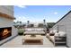 Inviting balcony with a fireplace and comfortable seating offering a relaxing outdoor retreat at 255 Mayfair Ct, Alpharetta, GA 30009