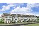 Stately townhomes with brick facade, black trim, and roof top decks in a desirable neighborhood at 255 Mayfair Ct, Alpharetta, GA 30009