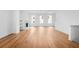 Large, bright living room with hardwood floors and a cozy fireplace at 255 Mayfair Ct, Alpharetta, GA 30009