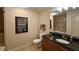 Elegant bathroom featuring a granite vanity, a shower over tub and decorative signage at 3300 Windy Ridge Se Pkwy # 1121, Atlanta, GA 30339