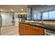 Stylish kitchen with granite counters, stainless appliances, and view of the living area at 3300 Windy Ridge Se Pkwy # 1121, Atlanta, GA 30339