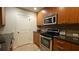 Modern kitchen featuring granite countertops, stainless steel appliances, and sleek cabinetry at 3300 Windy Ridge Se Pkwy # 1121, Atlanta, GA 30339