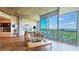 Cozy living room with large windows, hardwood floors, and scenic views from the balcony at 3300 Windy Ridge Se Pkwy # 1121, Atlanta, GA 30339