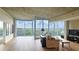 Bright living room with large windows and a balcony offering beautiful city views at 3300 Windy Ridge Se Pkwy # 1121, Atlanta, GA 30339