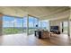 Spacious living room with hardwood floors and expansive windows overlooking a green landscape at 3300 Windy Ridge Se Pkwy # 1121, Atlanta, GA 30339