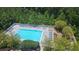 Aerial view of a serene pool area with lush surroundings and lounge chairs for relaxation at 3300 Windy Ridge Se Pkwy # 1121, Atlanta, GA 30339