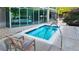 Relaxing pool with seating and glass enclosure for weather protection and year round enjoyment at 3300 Windy Ridge Se Pkwy # 1121, Atlanta, GA 30339