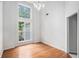 Bright dining room featuring hardwood floors, high ceilings, and natural light from large windows at 377 Tapley Rd, Villa Rica, GA 30180