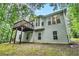 Exterior rear view of the home, showcasing the deck and backyard at 377 Tapley Rd, Villa Rica, GA 30180
