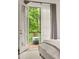 Relaxing balcony overlooking a lush, green landscape, accessible from the bedroom at 385 Anders N, Chattahoochee Hills, GA 30268