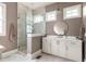 Well-lit bathroom featuring a walk-in shower, sleek vanity, and neutral color palette at 385 Anders N, Chattahoochee Hills, GA 30268