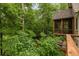 Inviting deck surrounded by trees and nature, perfect for relaxing outdoors at 385 Anders N, Chattahoochee Hills, GA 30268