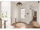 Bright entryway with a neutral color scheme and warm wood floors at 385 Anders N, Chattahoochee Hills, GA 30268