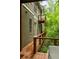 Exterior of home featuring private deck with outdoor seating among the trees at 385 Anders N, Chattahoochee Hills, GA 30268