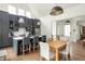 Modern kitchen with gray cabinets, white countertops, stainless steel appliances, and dining space at 385 Anders N, Chattahoochee Hills, GA 30268