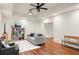 Cozy living room with hardwood floors, comfortable seating, and a modern ceiling fan at 385 Anders N, Chattahoochee Hills, GA 30268