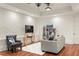 Living room featuring decorative fireplace with TV and shelf that provides a modern touch at 385 Anders N, Chattahoochee Hills, GA 30268