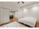 View from the main bedroom to the kitchen and dining area, featuring hardwood floors and modern decor at 385 Anders N, Chattahoochee Hills, GA 30268
