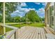 Rustic wooden back deck overlooking a lush green lawn, perfect for outdoor relaxation and enjoying the scenic backyard at 8140 Wood St Se, Covington, GA 30014