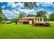 Expansive backyard with a charming deck, perfect for enjoying outdoor living and entertaining, with plenty of green space at 8140 Wood St Se, Covington, GA 30014