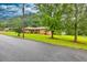 Lovely home with mature trees, manicured lawn, and charming curb appeal on a quiet street at 8140 Wood St Se, Covington, GA 30014