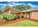 Beautiful brick home with a covered porch and well-kept landscaping, offering an inviting entrance and classic curb appeal at 8140 Wood St Se, Covington, GA 30014