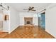 Bright living room with a brick fireplace, built-in shelving, and sliding glass doors at 8140 Wood St Se, Covington, GA 30014