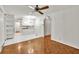 Open floor plan features hardwood floors and seamlessly connects the living room to the kitchen at 8140 Wood St Se, Covington, GA 30014