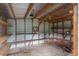 Open storage building with shelving and a wheelbarrow, providing ample space for organizing and storing tools at 8140 Wood St Se, Covington, GA 30014