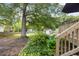 Spacious backyard featuring a charming shed, swing set, and lush landscaping at 1450 Walker Se St, Smyrna, GA 30080