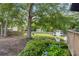 Spacious backyard featuring a charming shed, swing set, and lush landscaping at 1450 Walker Se St, Smyrna, GA 30080
