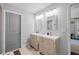A bright bathroom featuring double vanity sinks and a clean, modern design at 1450 Walker Se St, Smyrna, GA 30080