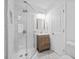 Bright bathroom featuring tiled shower with glass door, vanity, and updated fixtures at 1450 Walker Se St, Smyrna, GA 30080
