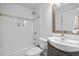 Stylish bathroom with subway tile shower, modern vanity, and updated fixtures at 1450 Walker Se St, Smyrna, GA 30080