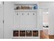 Mud room with a coat rack, storage baskets, and a view into the bedroom at 1450 Walker Se St, Smyrna, GA 30080