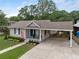 Charming single-story home with a covered carport and landscaped front yard at 1450 Walker Se St, Smyrna, GA 30080