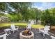 Cozy backyard fire pit with seating and a shed, perfect for outdoor relaxation at 1450 Walker Se St, Smyrna, GA 30080