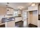 Modern kitchen featuring white cabinetry, dark countertops, and a view into the dining area at 1450 Walker Se St, Smyrna, GA 30080