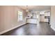 Open-concept kitchen and dining area with modern lighting and white cabinetry at 1450 Walker Se St, Smyrna, GA 30080
