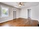 Bright living room featuring hardwood floors, modern ceiling fan, and fresh paint at 1450 Walker Se St, Smyrna, GA 30080