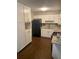 Well-lit kitchen features white cabinets, granite countertops, and stainless steel appliances at 2058 Pair Sw Rd, Marietta, GA 30008