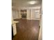Open living room featuring a stone fireplace and custom built-in shelving at 2058 Pair Sw Rd, Marietta, GA 30008