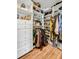 Walk-in closet with custom shelving, drawers, and ample storage space for clothes and accessories at 3235 Roswell Ne Rd # 508, Atlanta, GA 30305