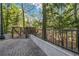 The property offers convenient outdoor access with a paved walkway and wooden bridge surrounded by lush greenery at 3235 Roswell Ne Rd # 508, Atlanta, GA 30305