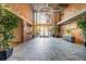 Spacious lobby with high ceilings, exposed brick, and attractive stone tile flooring at 3235 Roswell Ne Rd # 508, Atlanta, GA 30305