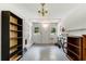 Basement offers a blank canvas, featuring concrete floors, shelving, and natural light, perfect for storage and hobbies at 553 Collingwood Dr, Decatur, GA 30032