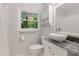 Bathroom with granite counters, vessel sink, and updated fixtures, creating a modern and inviting space at 553 Collingwood Dr, Decatur, GA 30032